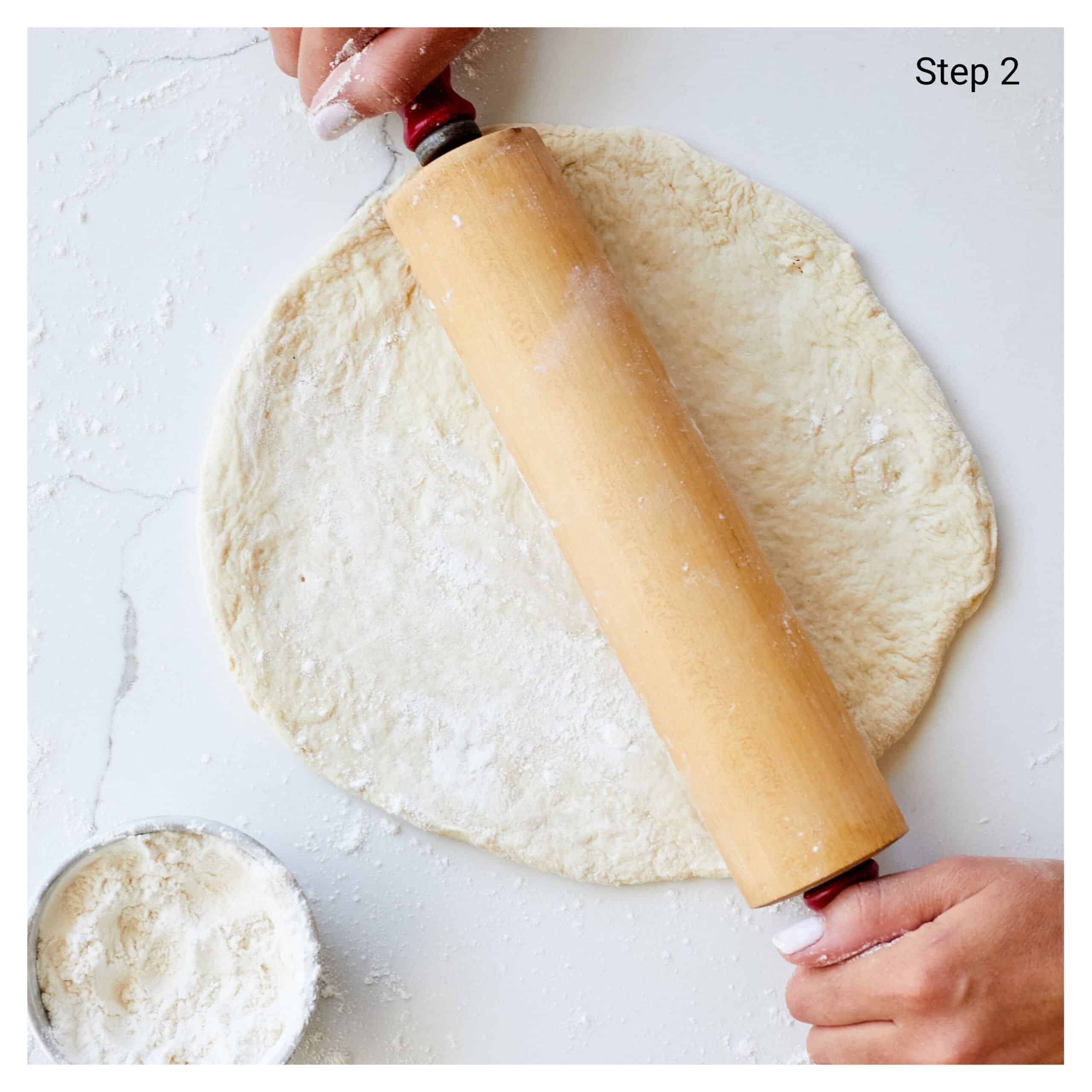 Step-by-step instructions on how to make Pan Fried Pizza (Stovetop, No Oven): roll each dough ball on a lightly floured surface into a 10-inch (25 ½ cm) circle.