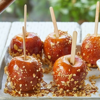 Chewy Caramel Apples covered with peanuts