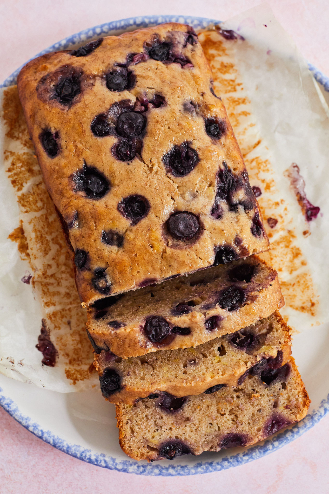 A top-down view of my blueberry banana bread recipe, with part of the loaf sliced.