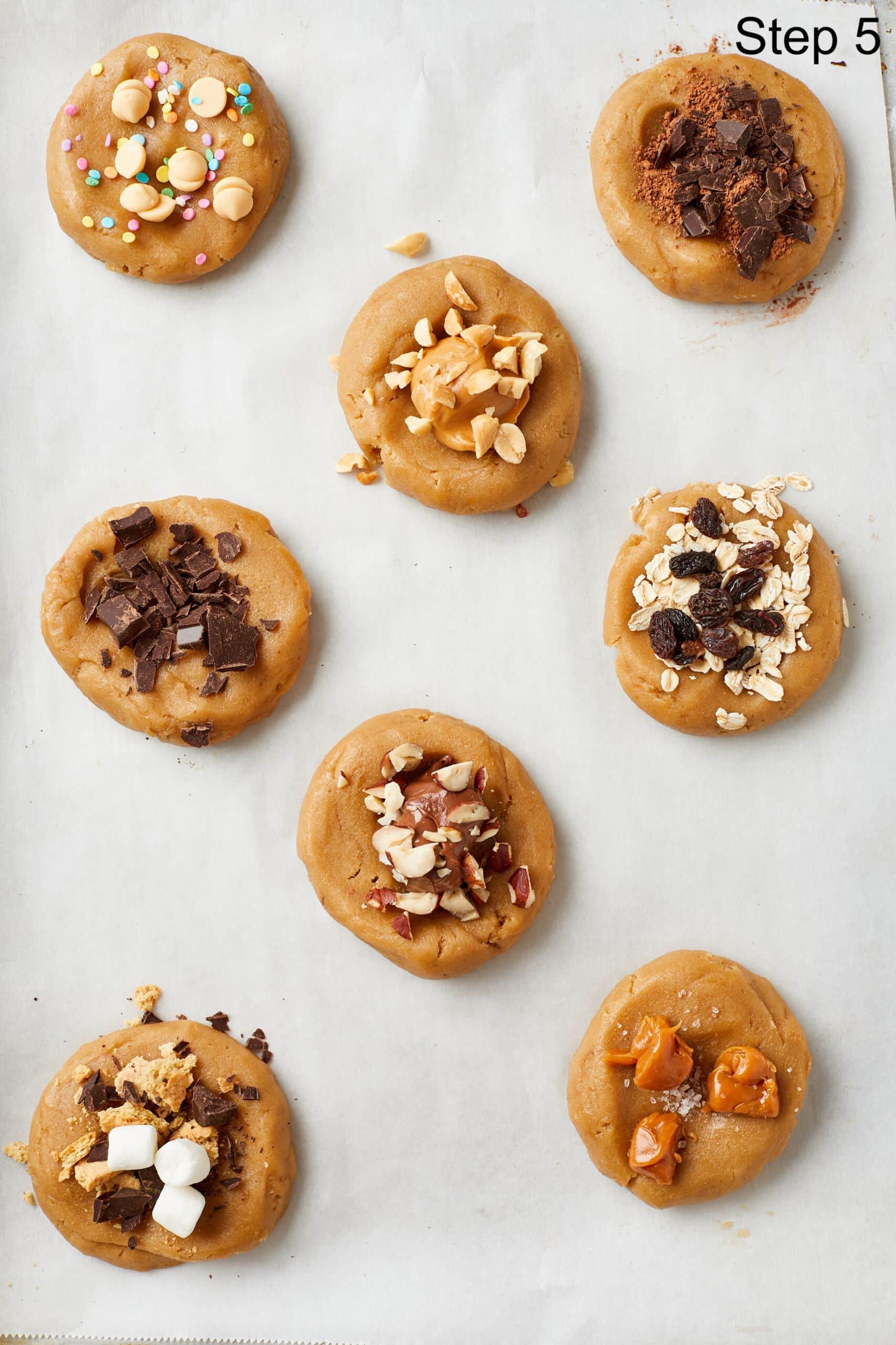 Step-by-step instructions on How to Make Cookie Dough Recipe With Endless Mix-ins: For each flavor, make a well in the center of a portion of dough. Add the mix-ins of your choice and fold the dough over itself a few times to ensure that the ingredients are incorporated.