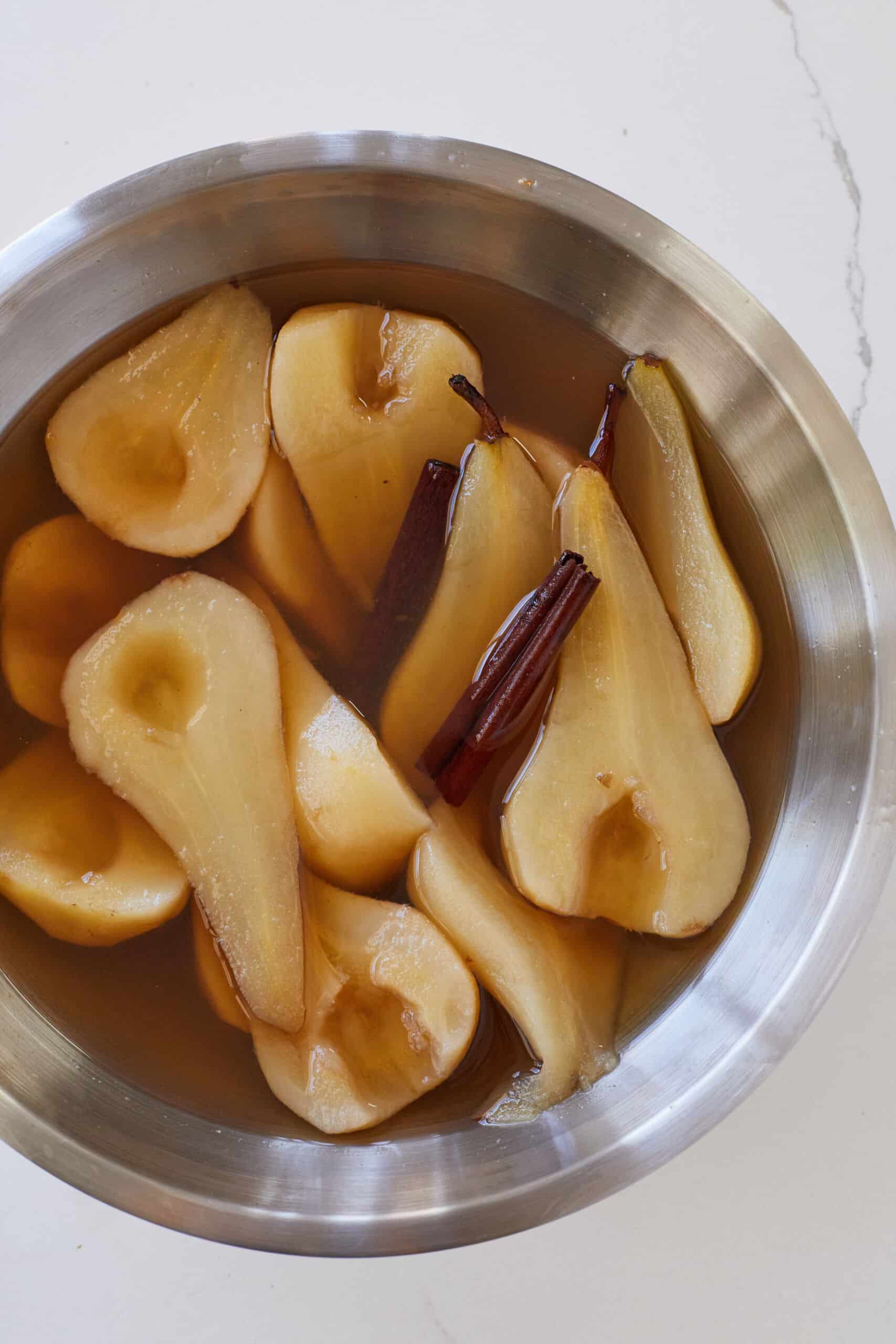 Maple Poached Pears with cinnamon sticks