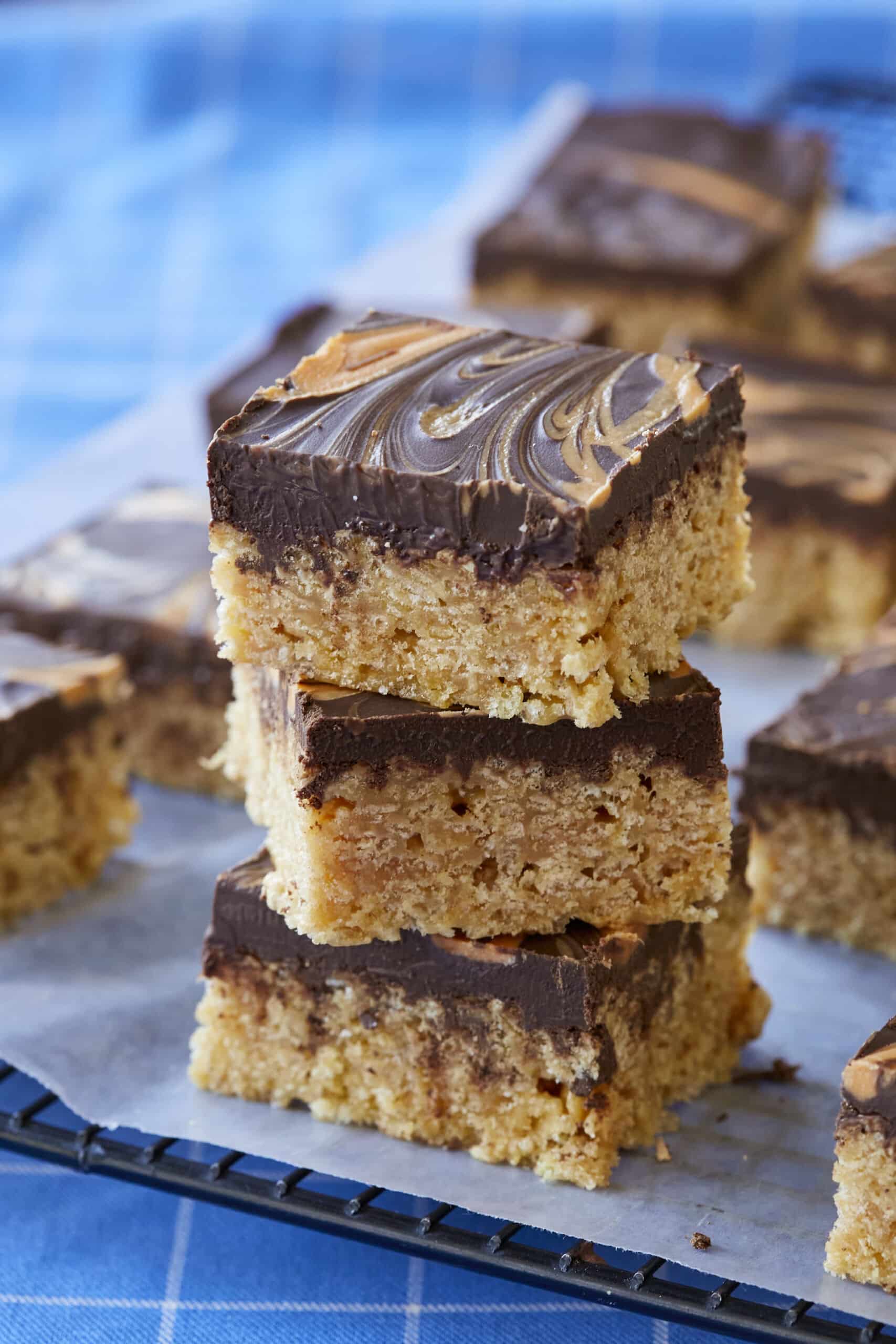 A close-up shot at Easy Scotcheroos shows these layered treats featuring a base of crispy rice cereal with a milk chocolate, peanut butter and butterscotch topping.