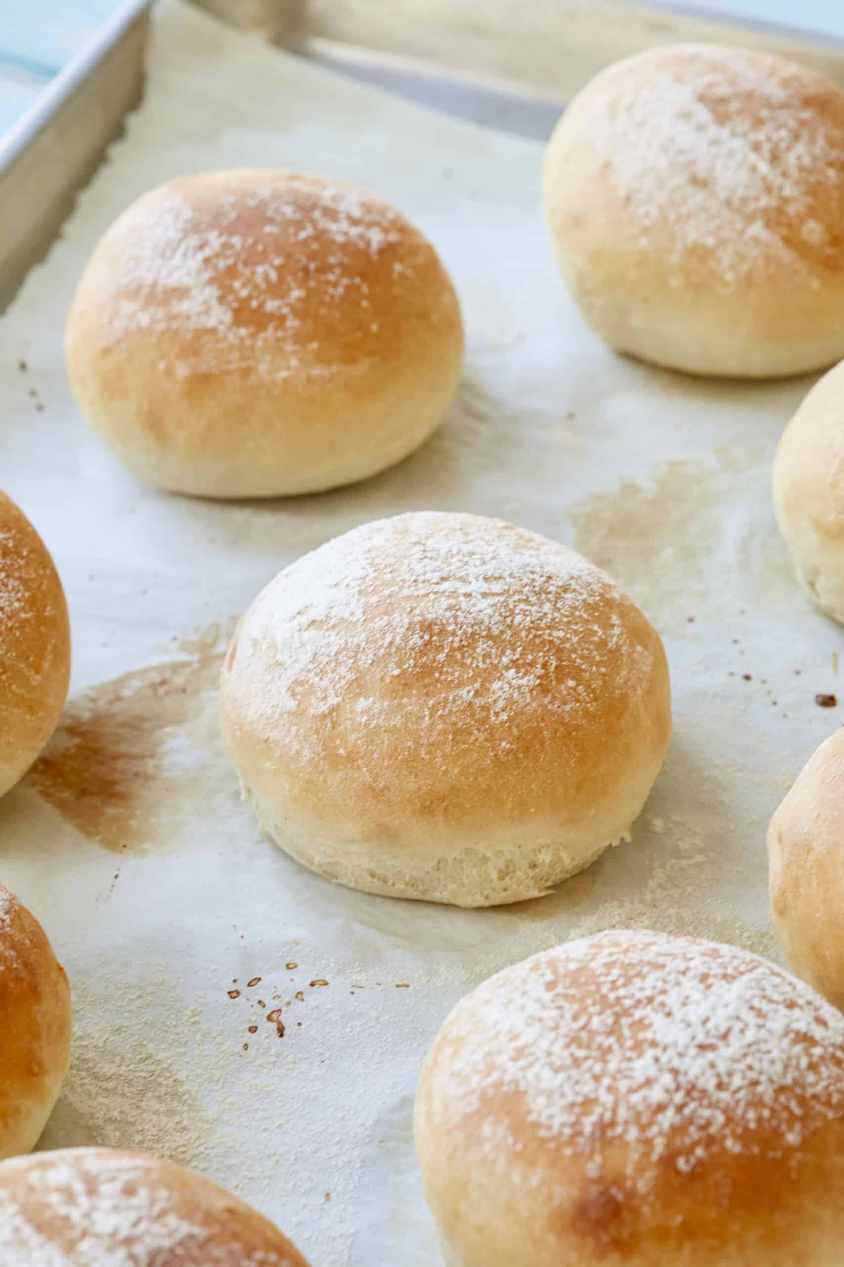 Soft, fluffy Scottish Baps are lightly dusted with flour.