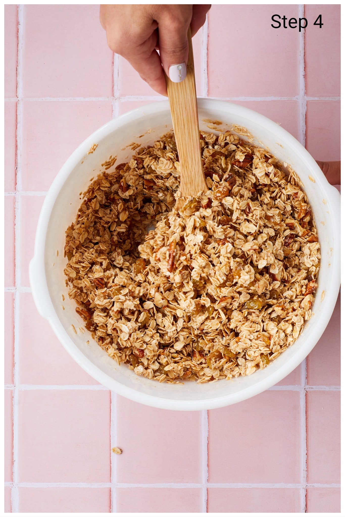 Making Healthy Granola: Mix the oats until they are thoroughly and evenly coated in the oil mixture.