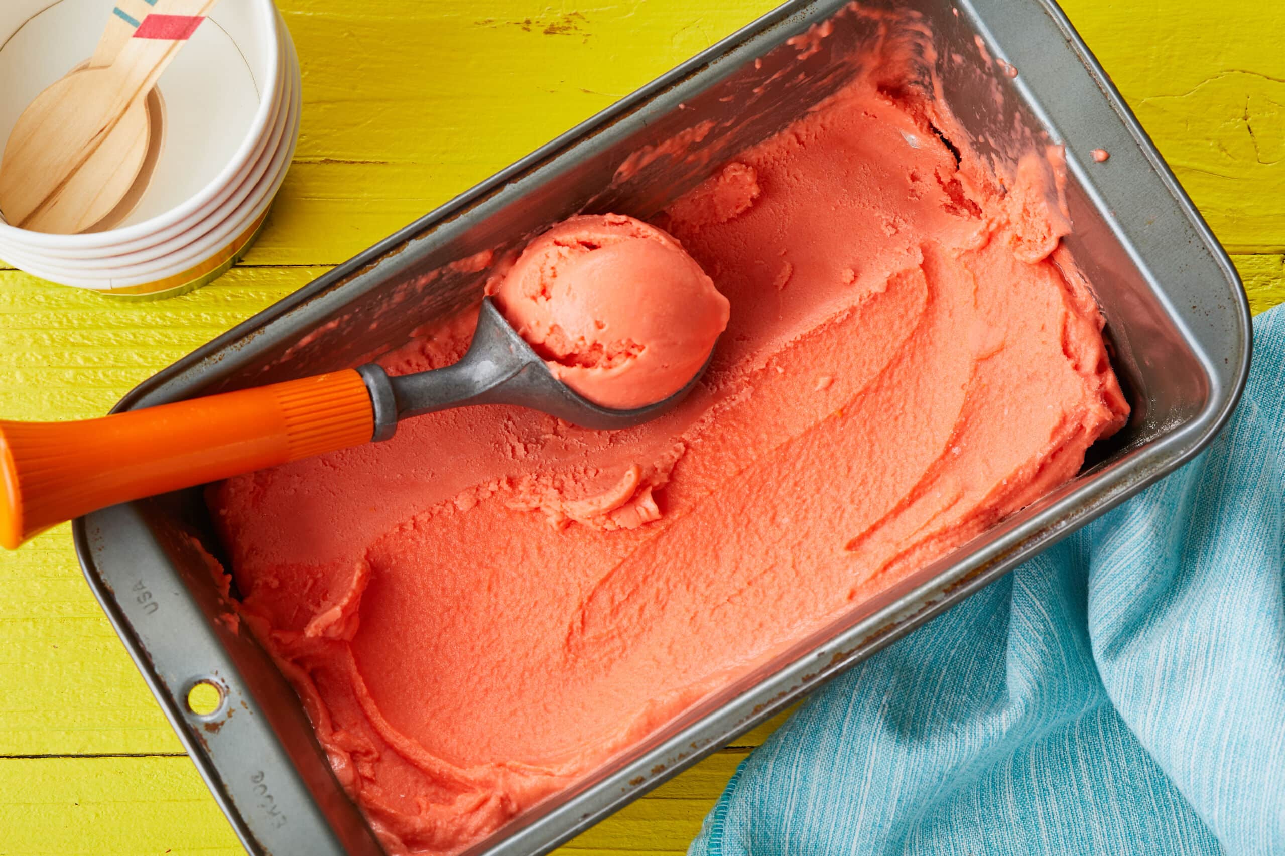 Sicilian Eggless Watermelon Gelato is thick and smooth, in vibrant red-orange color.